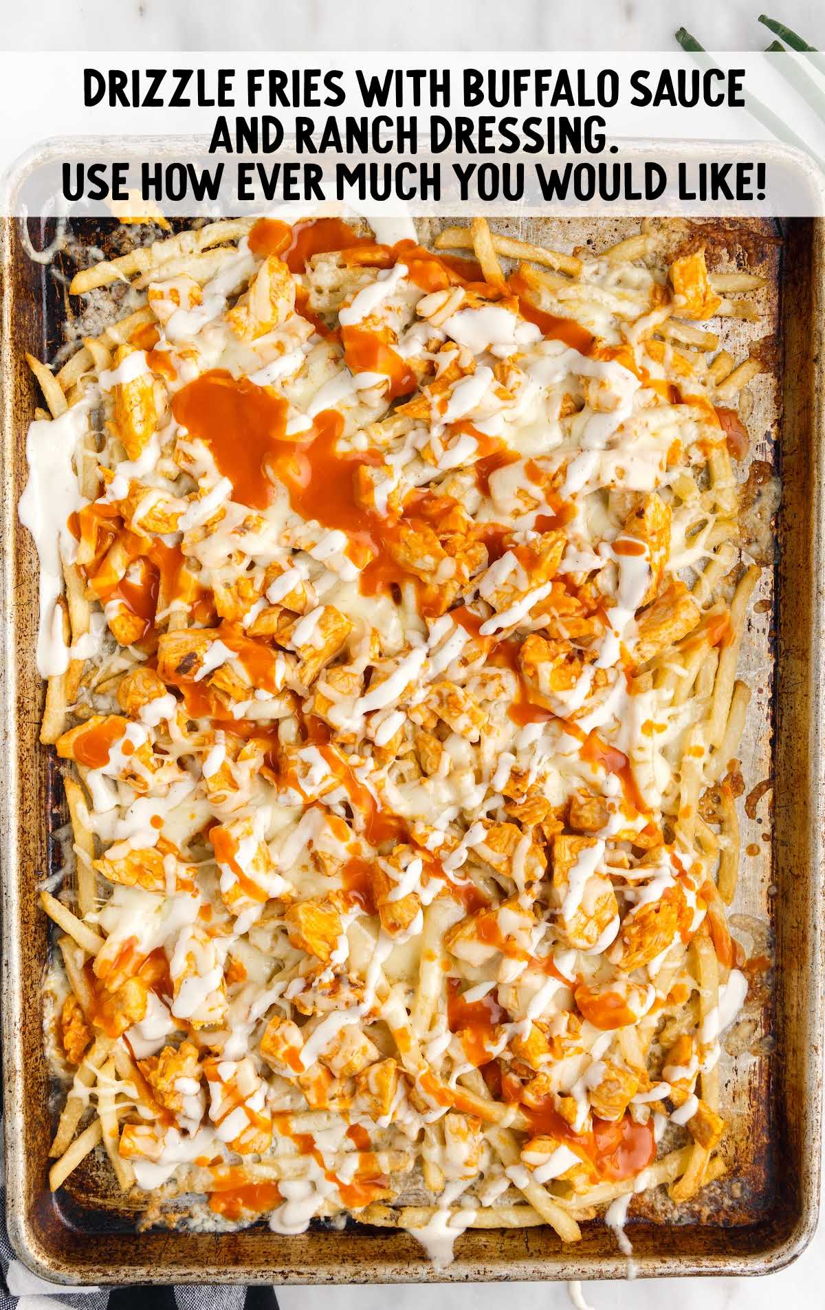 Buffalo Chicken Fries process shot of fries topped with ranch and buffalo sauce