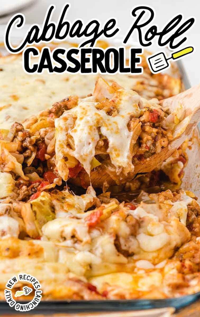 close up shot of a baking dish of Cabbage Roll Casserole with a large wooden spoon