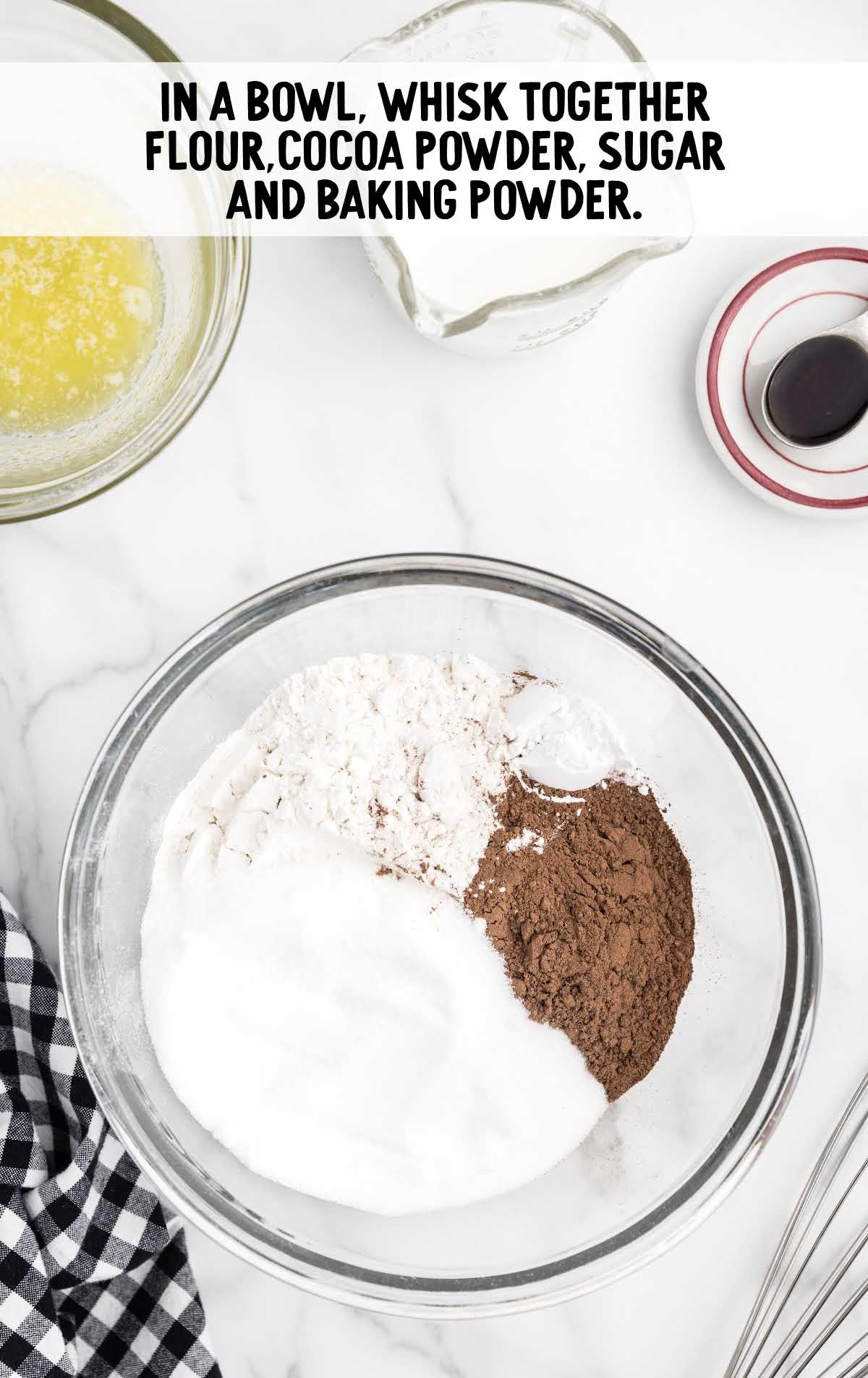 flour, cocoa powder, sugar, and baking powder whisked in a bowl