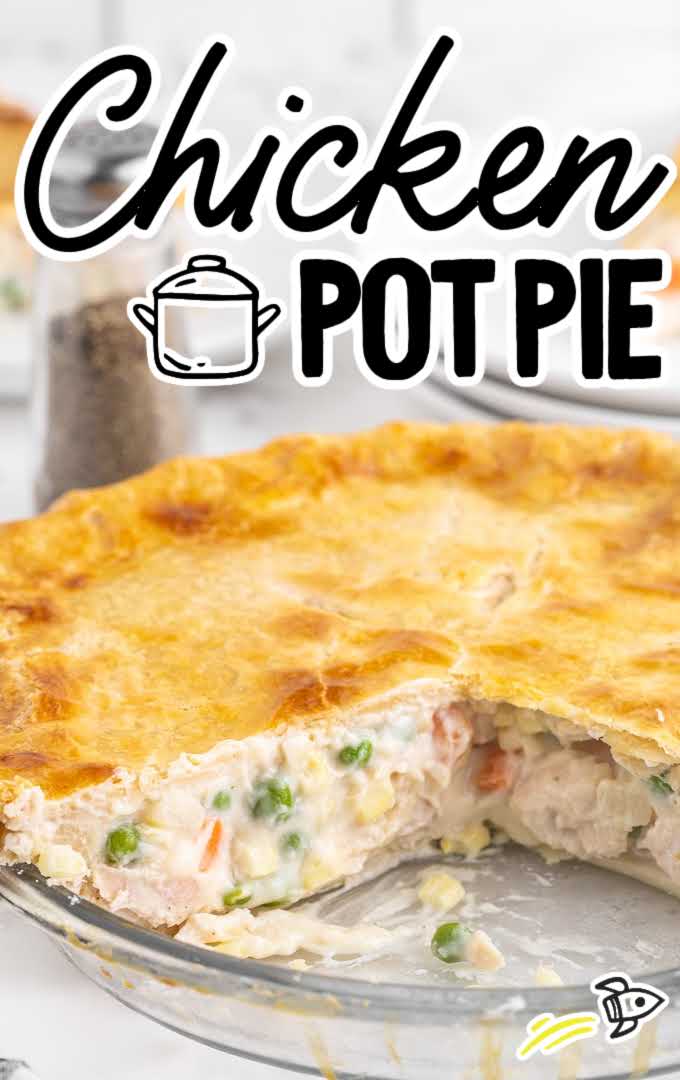 close up shot of Chicken Pot Pie with a slice missing in a baking dish