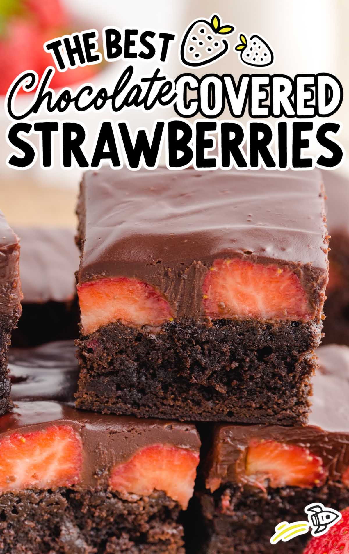 close up shot of Chocolate Covered Strawberry Brownies stacked on top of each other