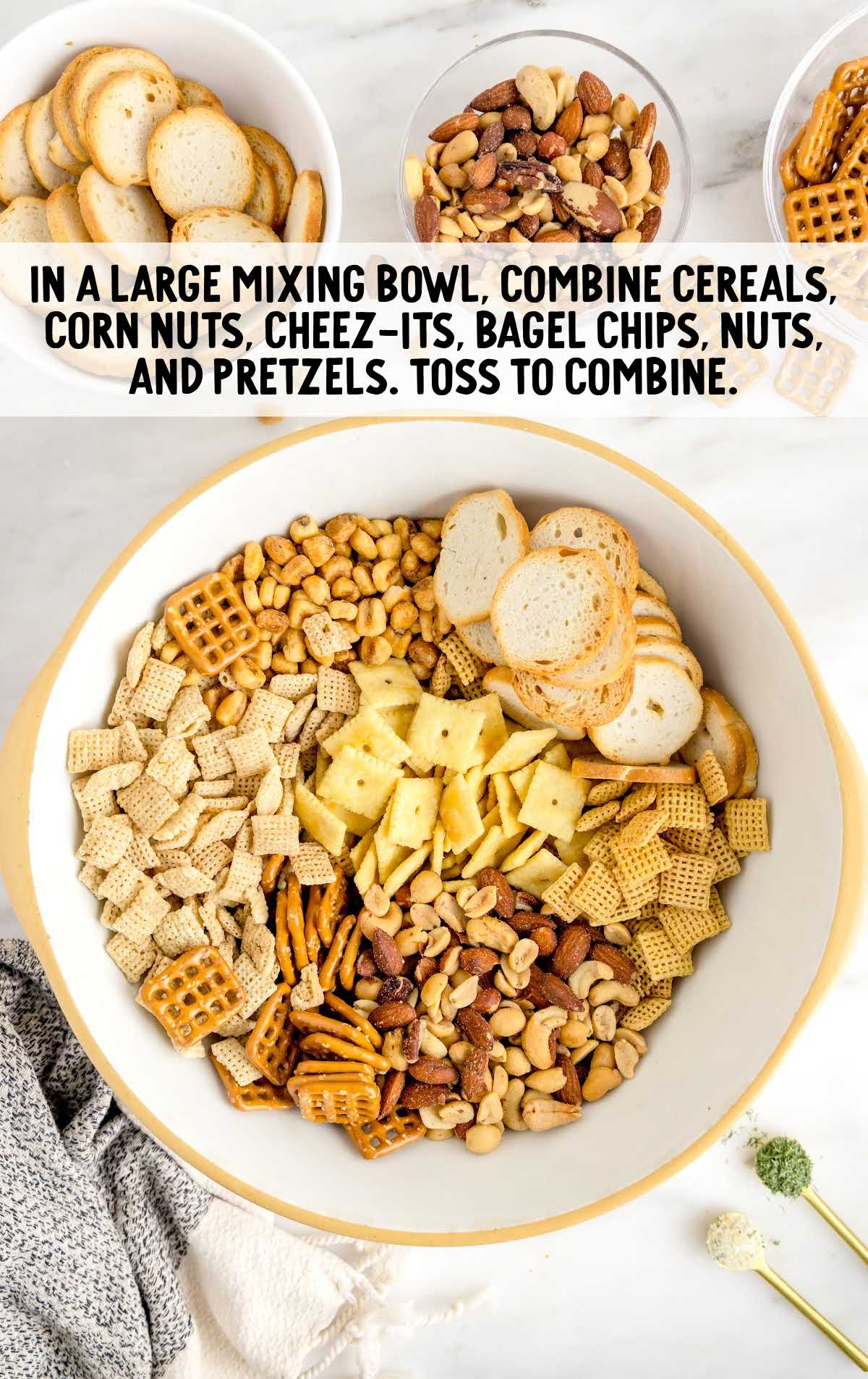 Dill Pickle Chex Mix process shot of ingredients combined in a bowl
