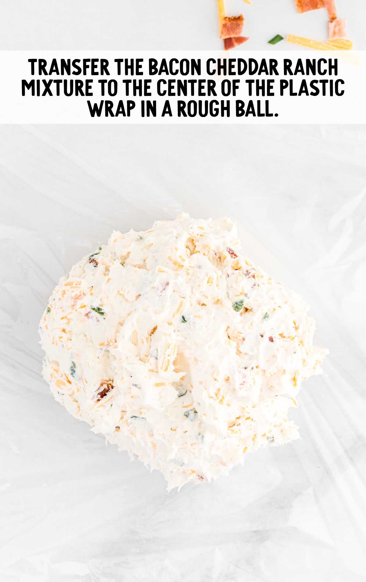 Football Cheese Ball process shot of mixture placed on plastic wrap