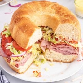 close up shot of a Party Sub with slices missing on a plate
