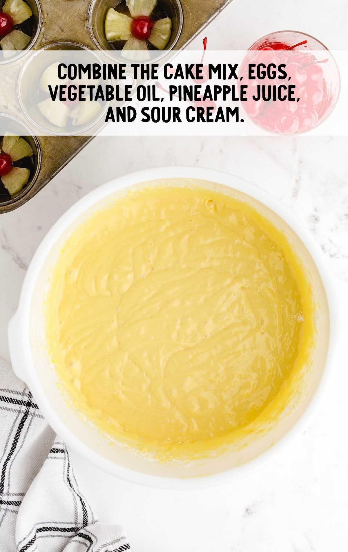 cake mix, eggs, vegetable oil, pineapple juice and sour cream combined 