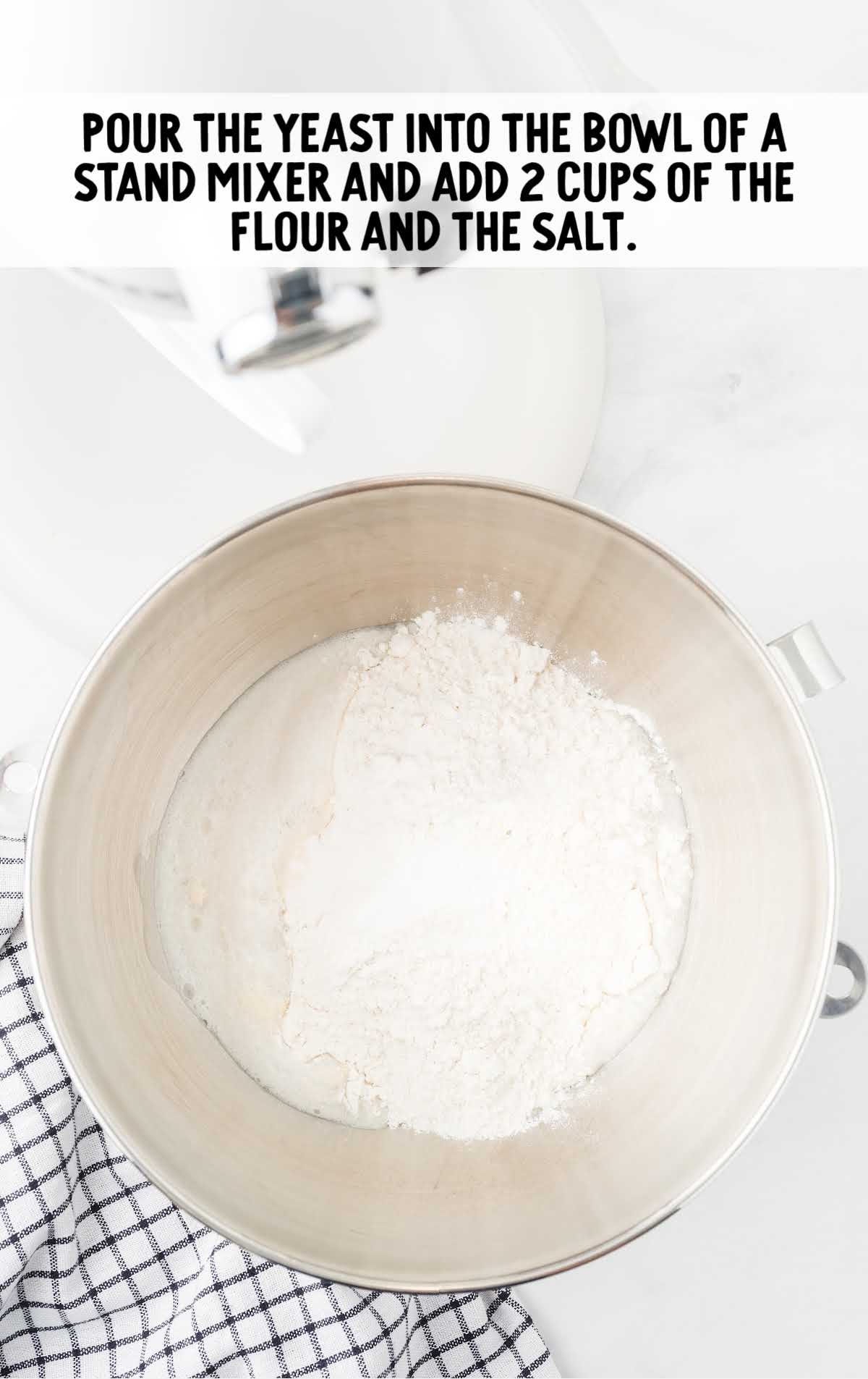 yeast poured into a bowl and mixed with flour and salt