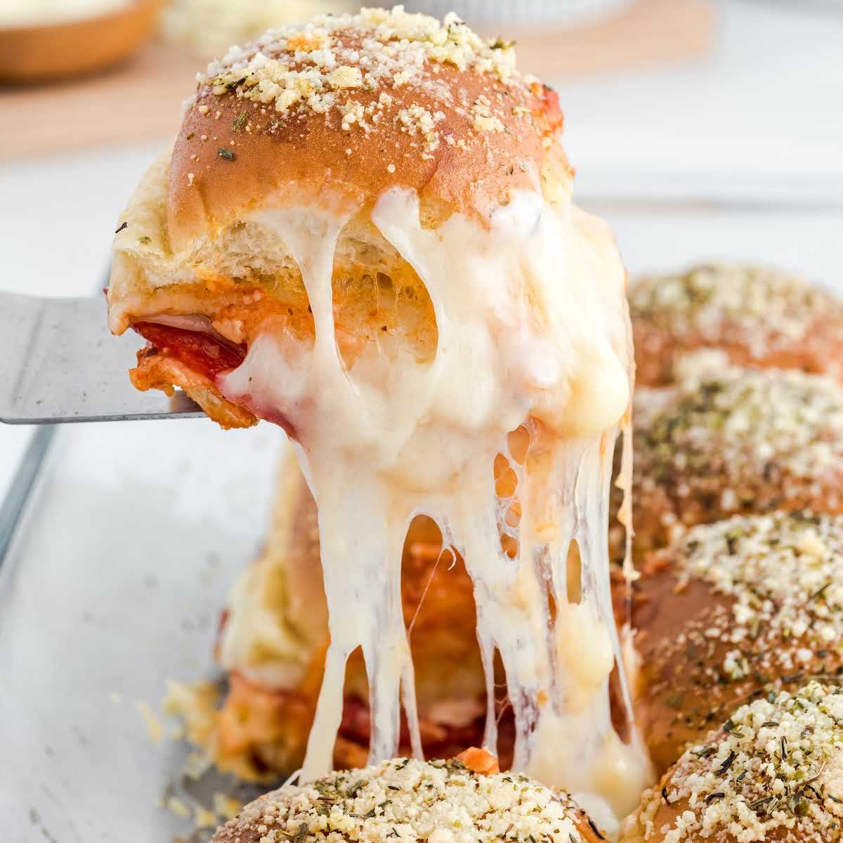 close up shot of Pizza Sliders on a spatula