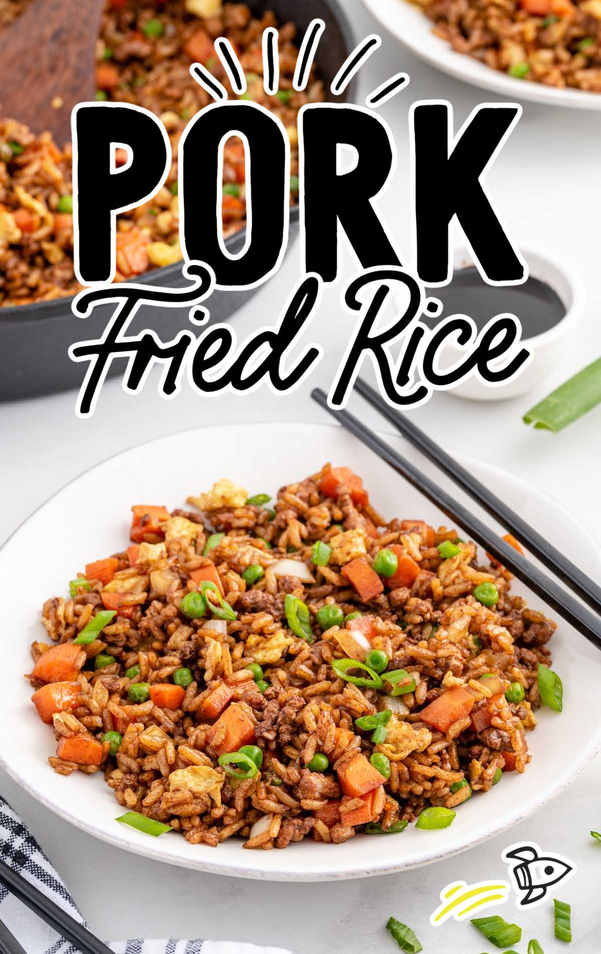 close up shot of a plate of Pork Fried Rice with chopsticks