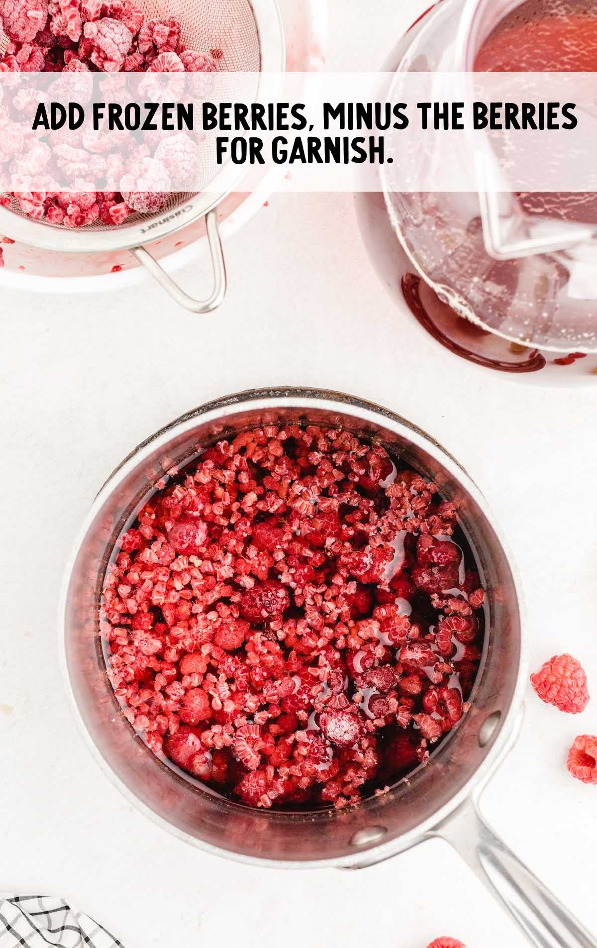 Raspberry Iced Tea process shot of frozen berries in a pot