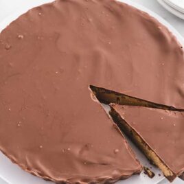 a Reese's Peanut Butter Cup Pie with a slice being taken out of it