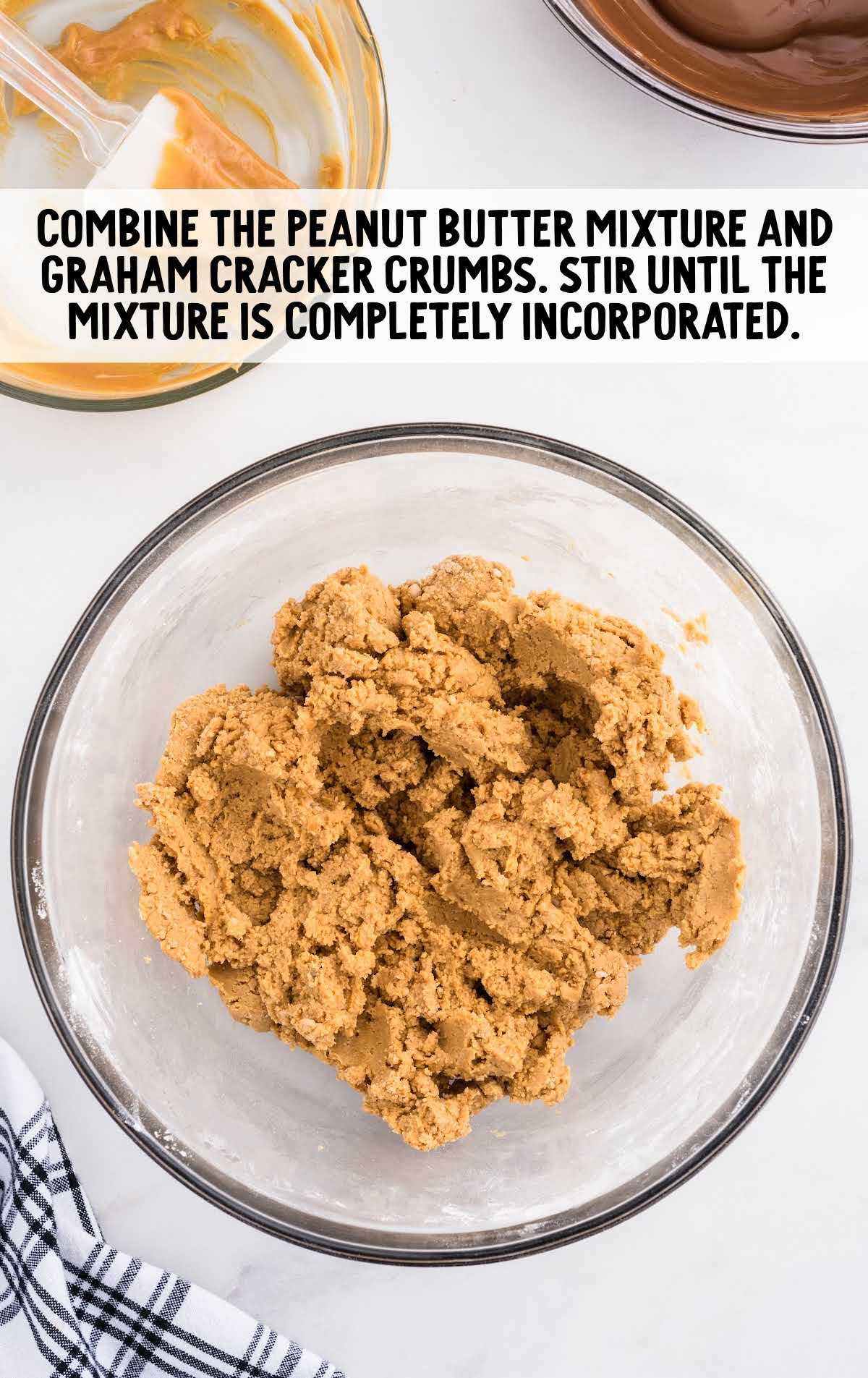 peanut butter mixture and graham cracker crumbs combined in a bowl