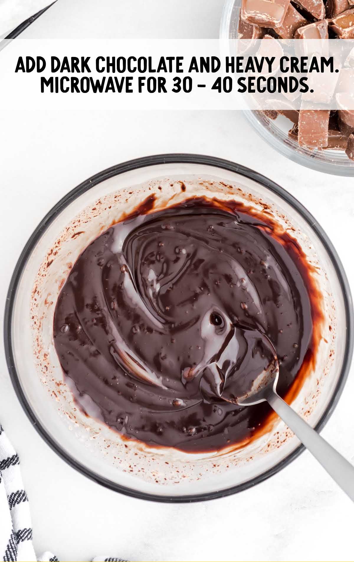 dark chocolate and heave cream melted in a bowl