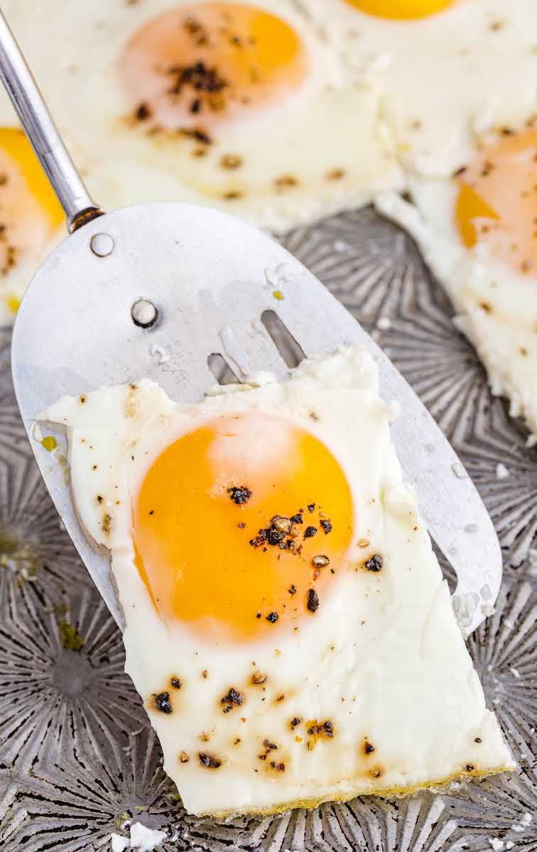 close up shot of Sheet Pan Eggs on a spatula