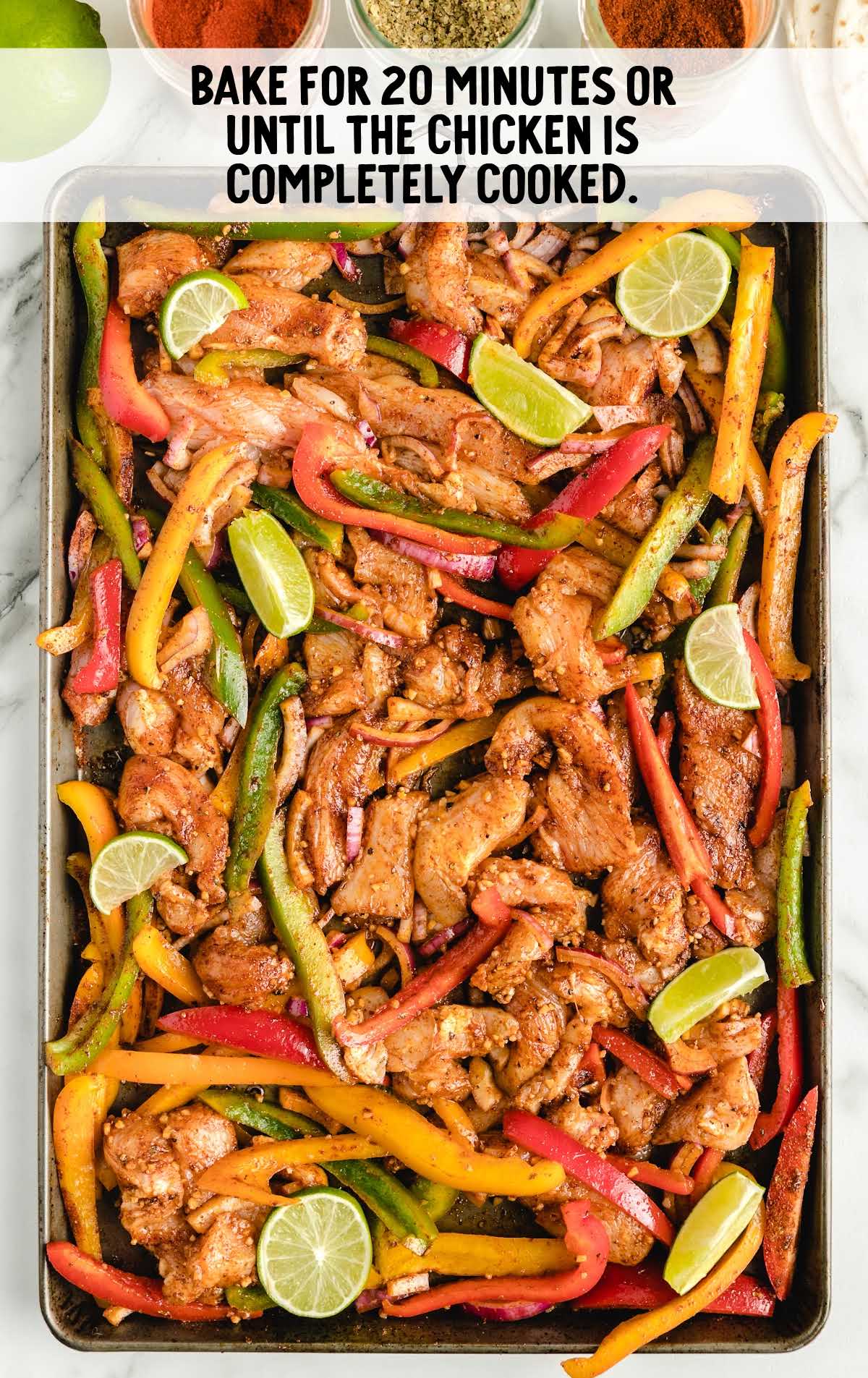 Sheet Pan Fajitas process shot after chicken and vegetables are baked