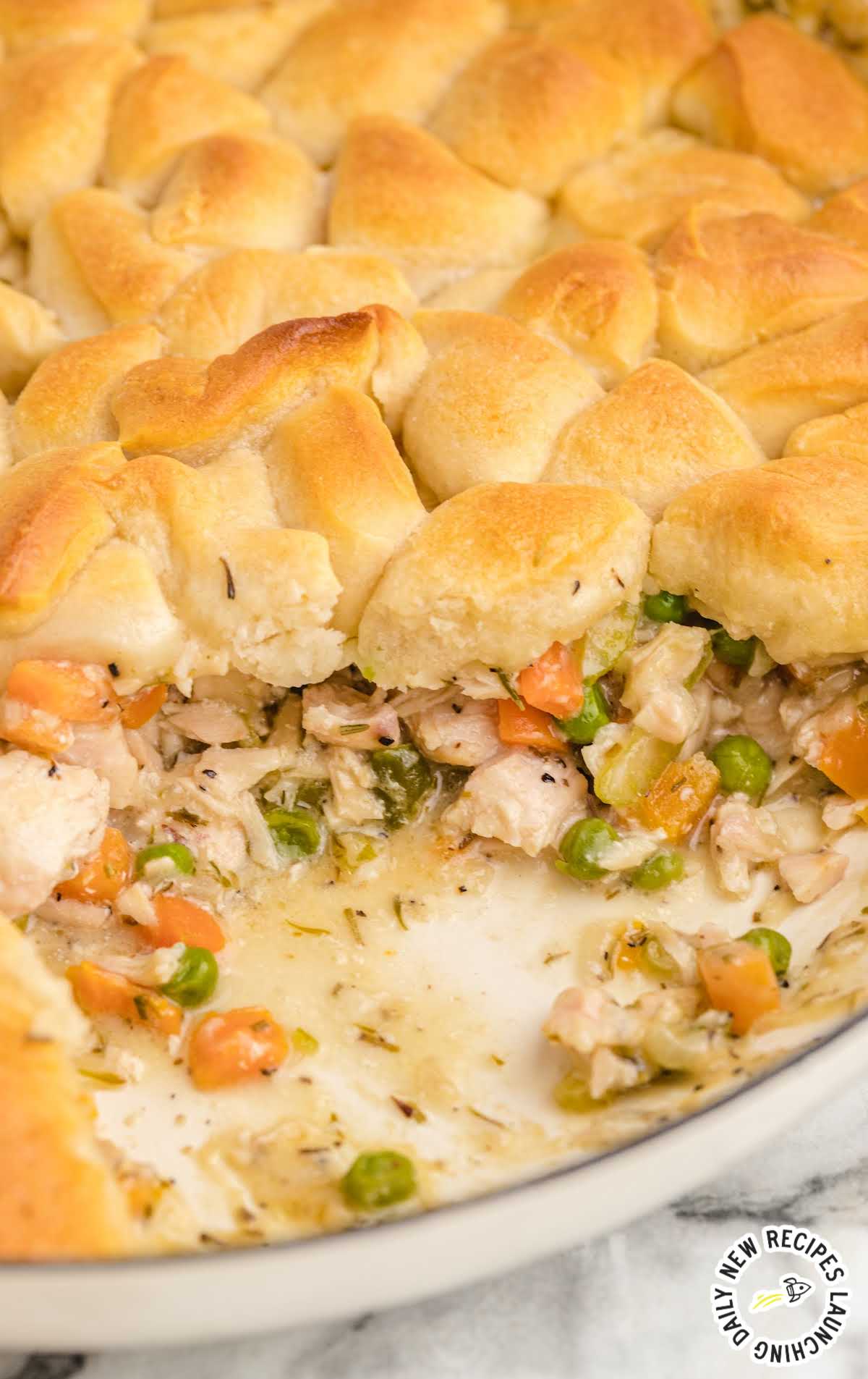 close up shot of skillet chicken pot pie in a baking dish