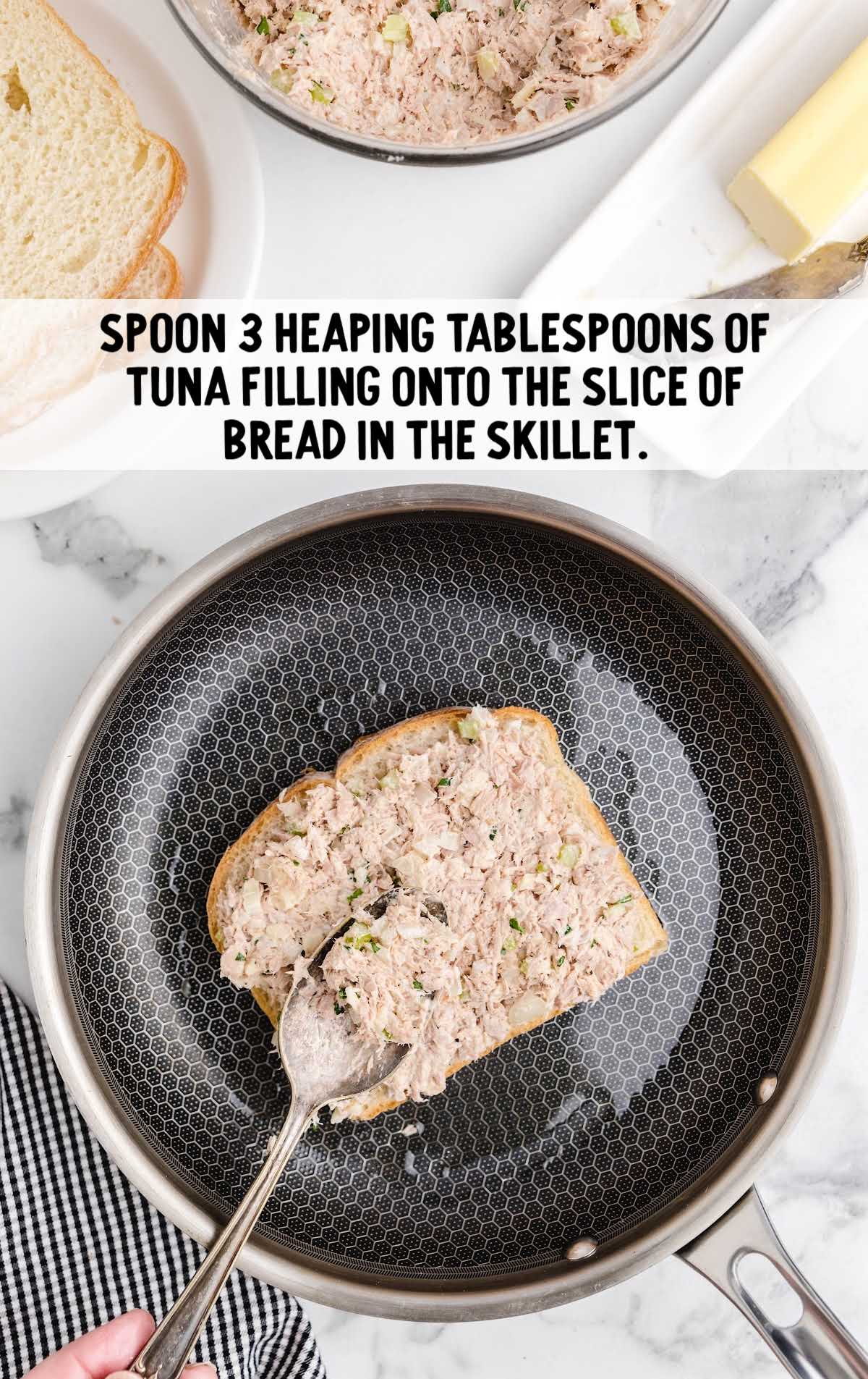 tuna mixture scooped over bread on the skillet