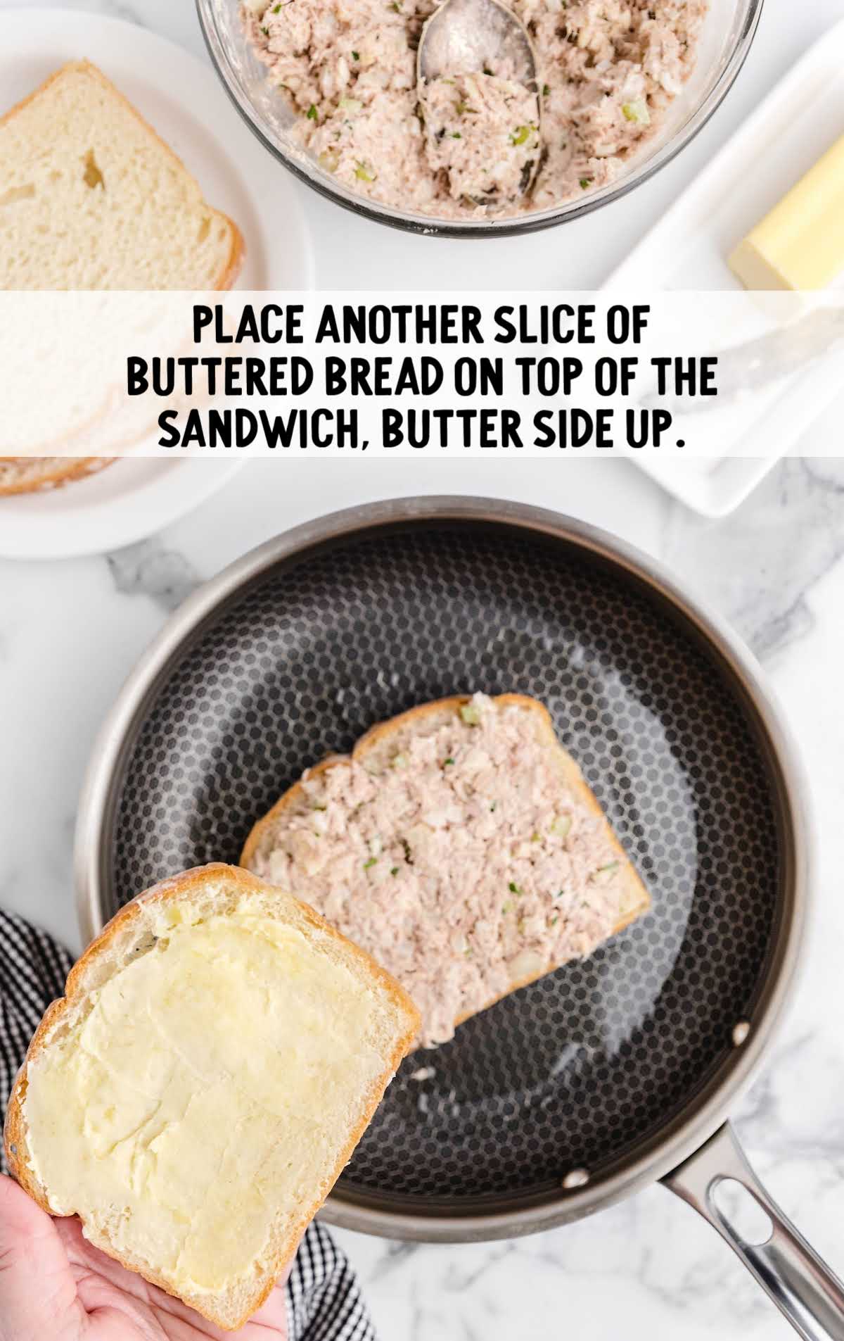 buttered bread placed on top of tuna mixture