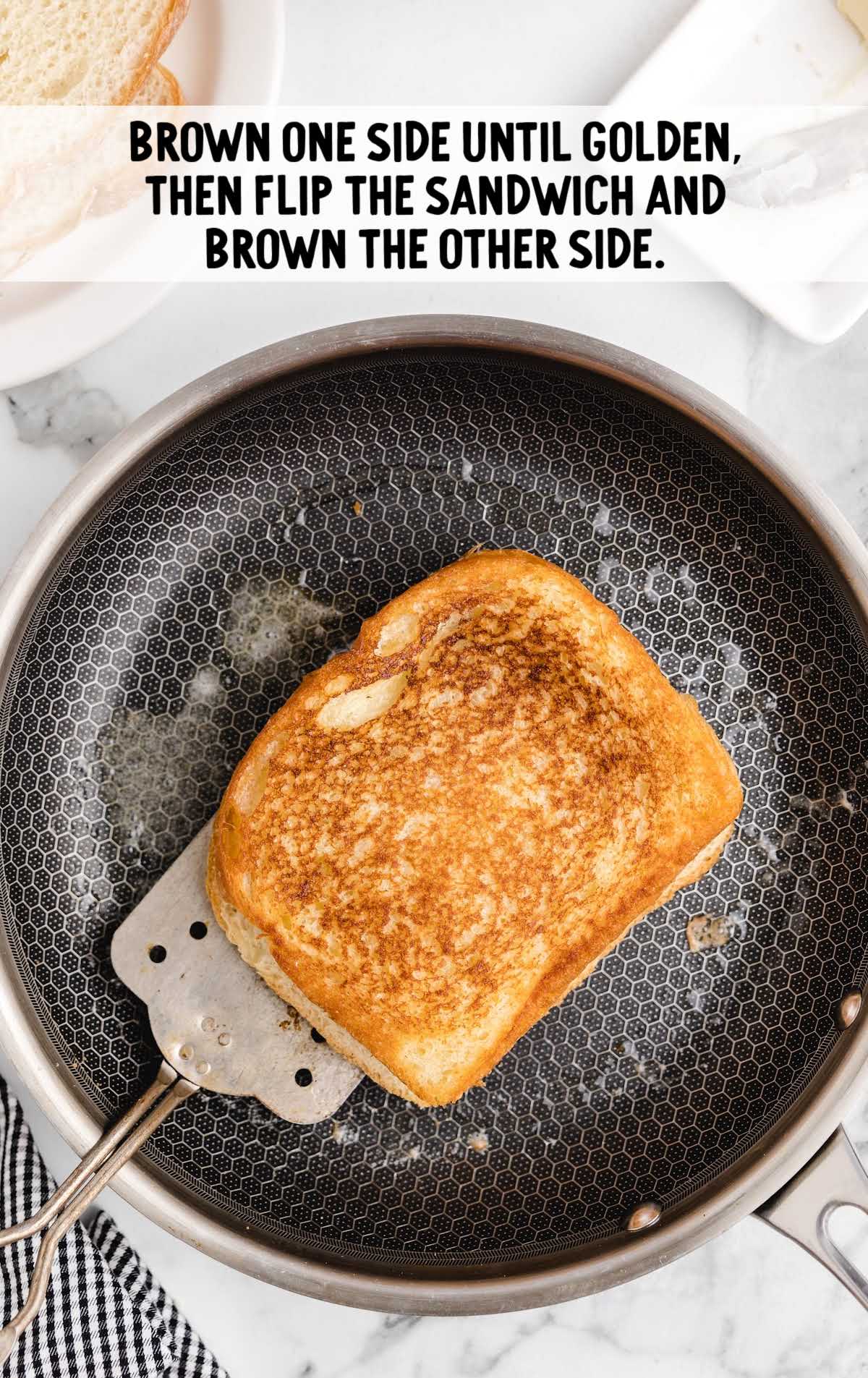 Tuna Melt process shot off sandwich being cooked on a skillet