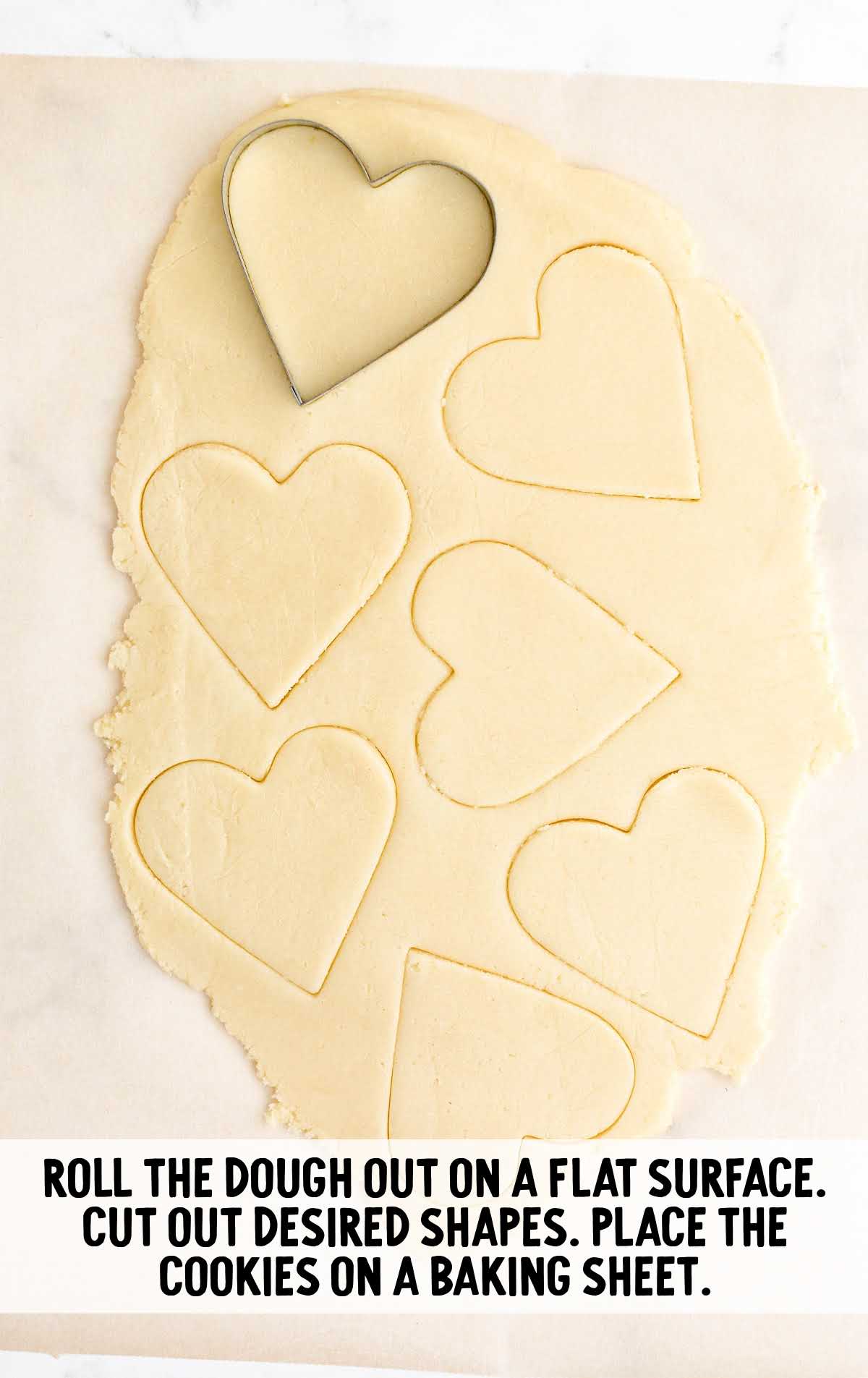 Valentine Sugar Cookies process shot of hearts cut out of cookie dough