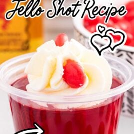 close up shot of fireball jello shots topped with whipped cream and cinnamon candies