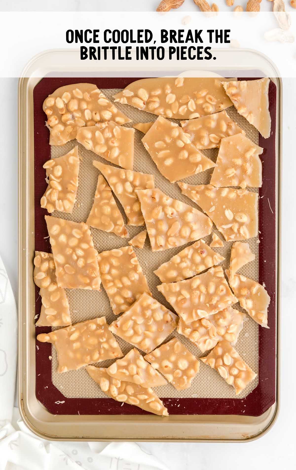 peanut brittle process shot of cooled brittle broken into pieces