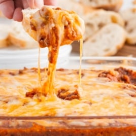 bread dipping into sloppy joe dip