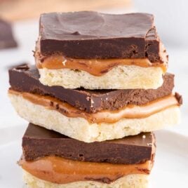 close up shot of twix bars stacked on top of each other
