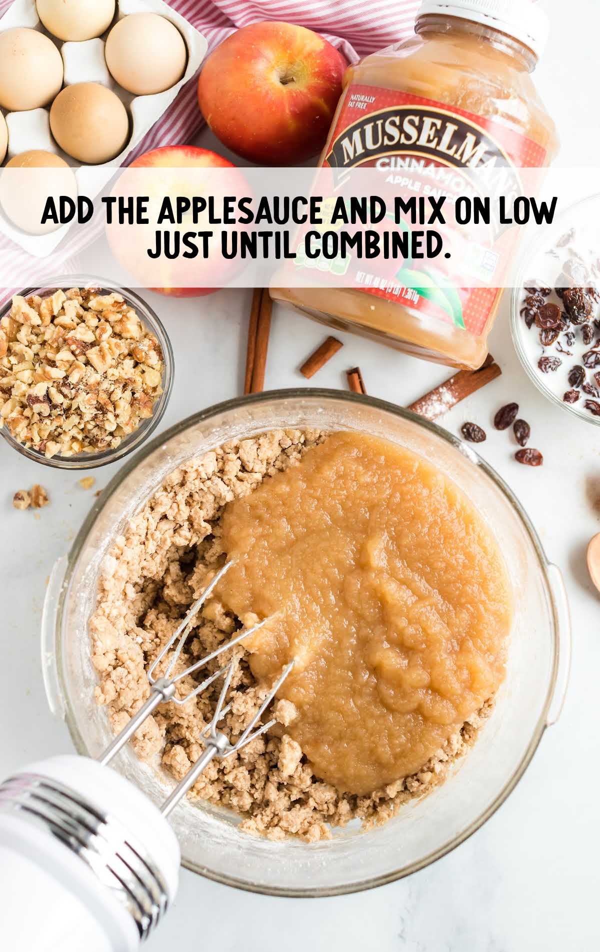 applesauce added to the ingredients in a bowl