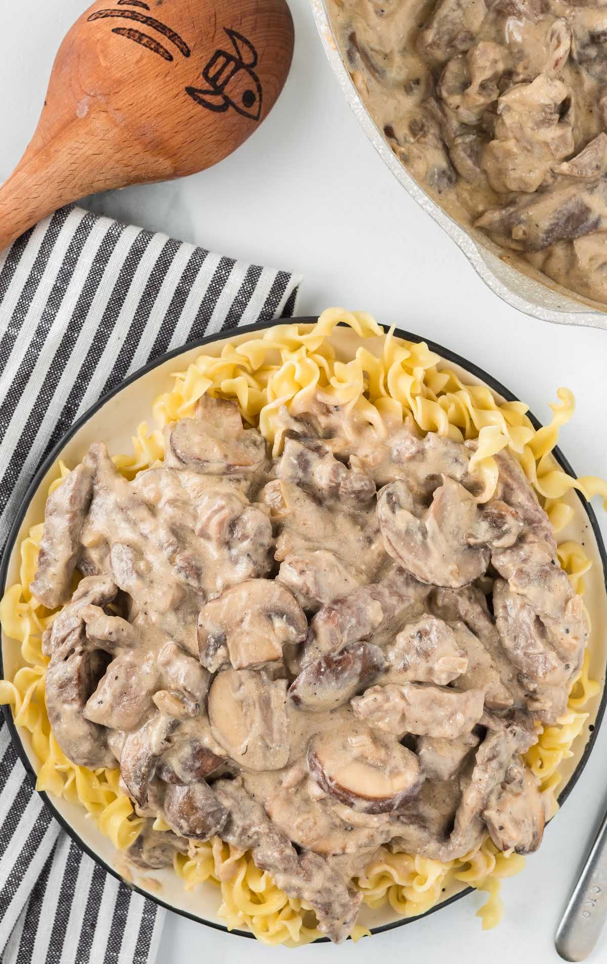 overhead shot of a bowl of Beef Stroganoff served over egg noddles