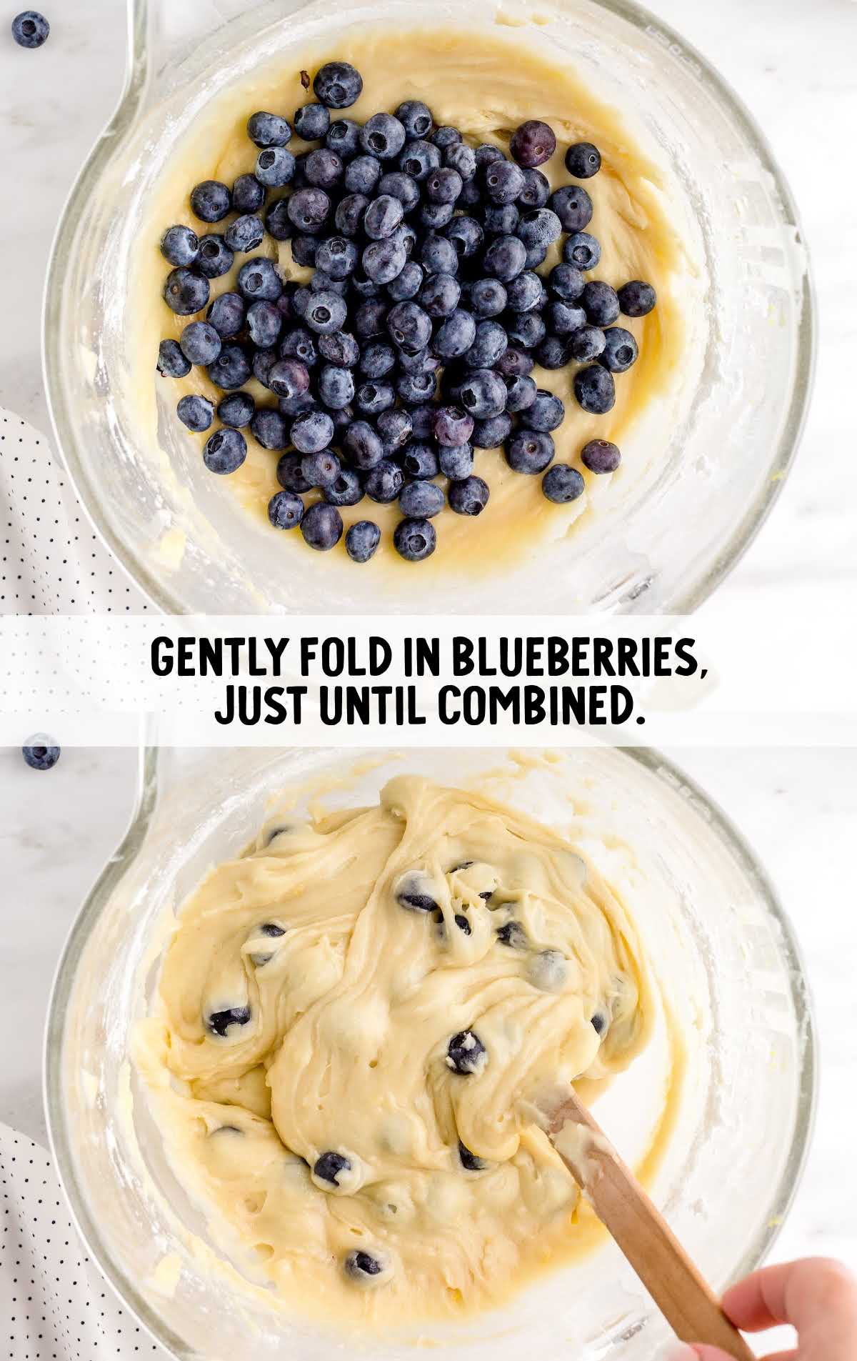 blueberries folded into the measuring cup of batter