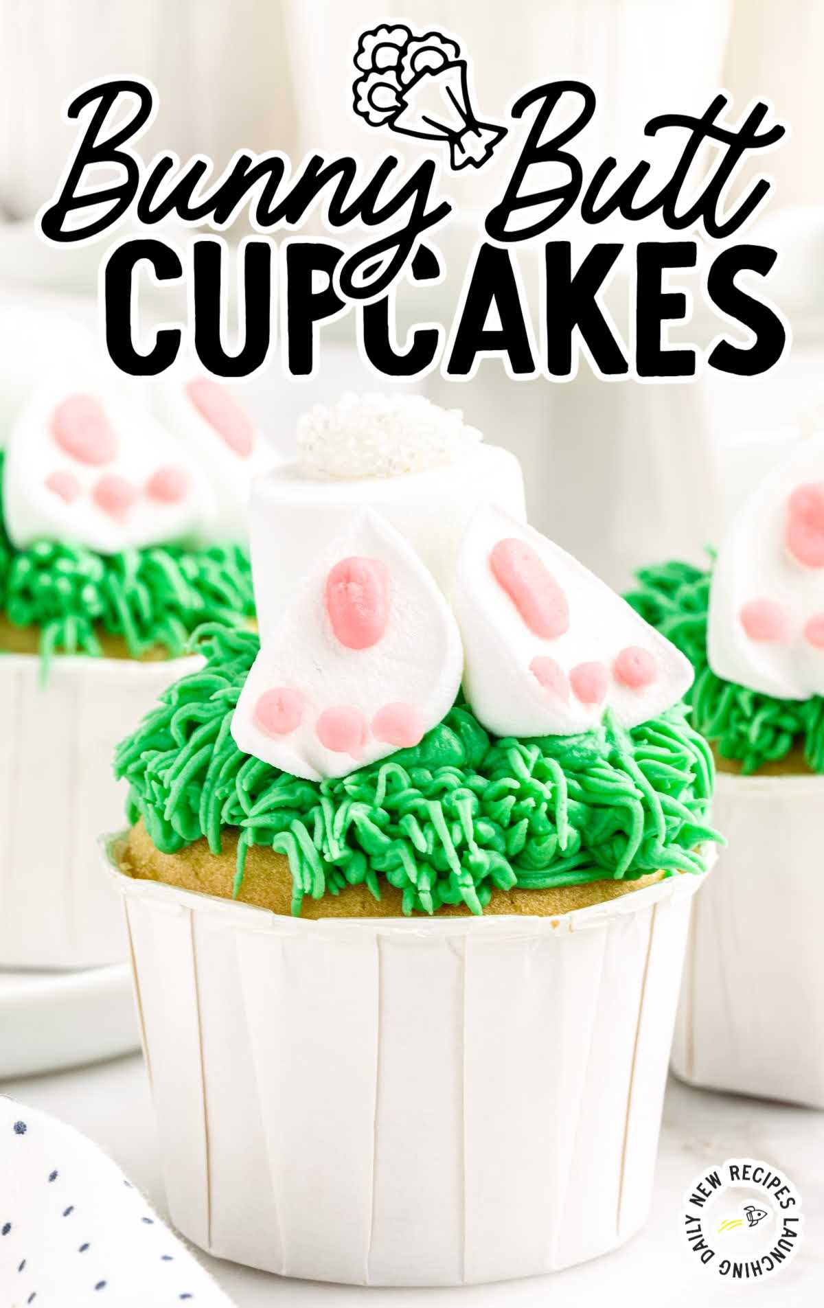 close up shot of cupcakes decorated with grass and bunnies