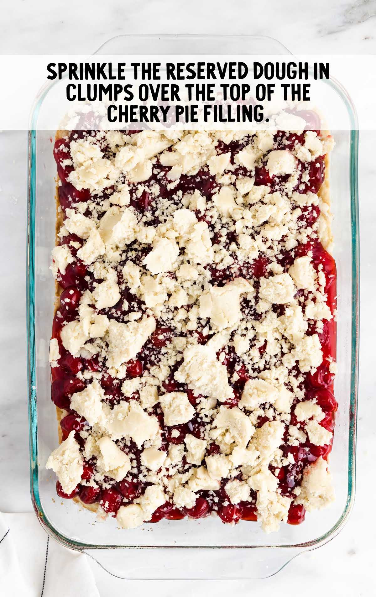 reserved dough sprinkled on top of the cherry pie filling