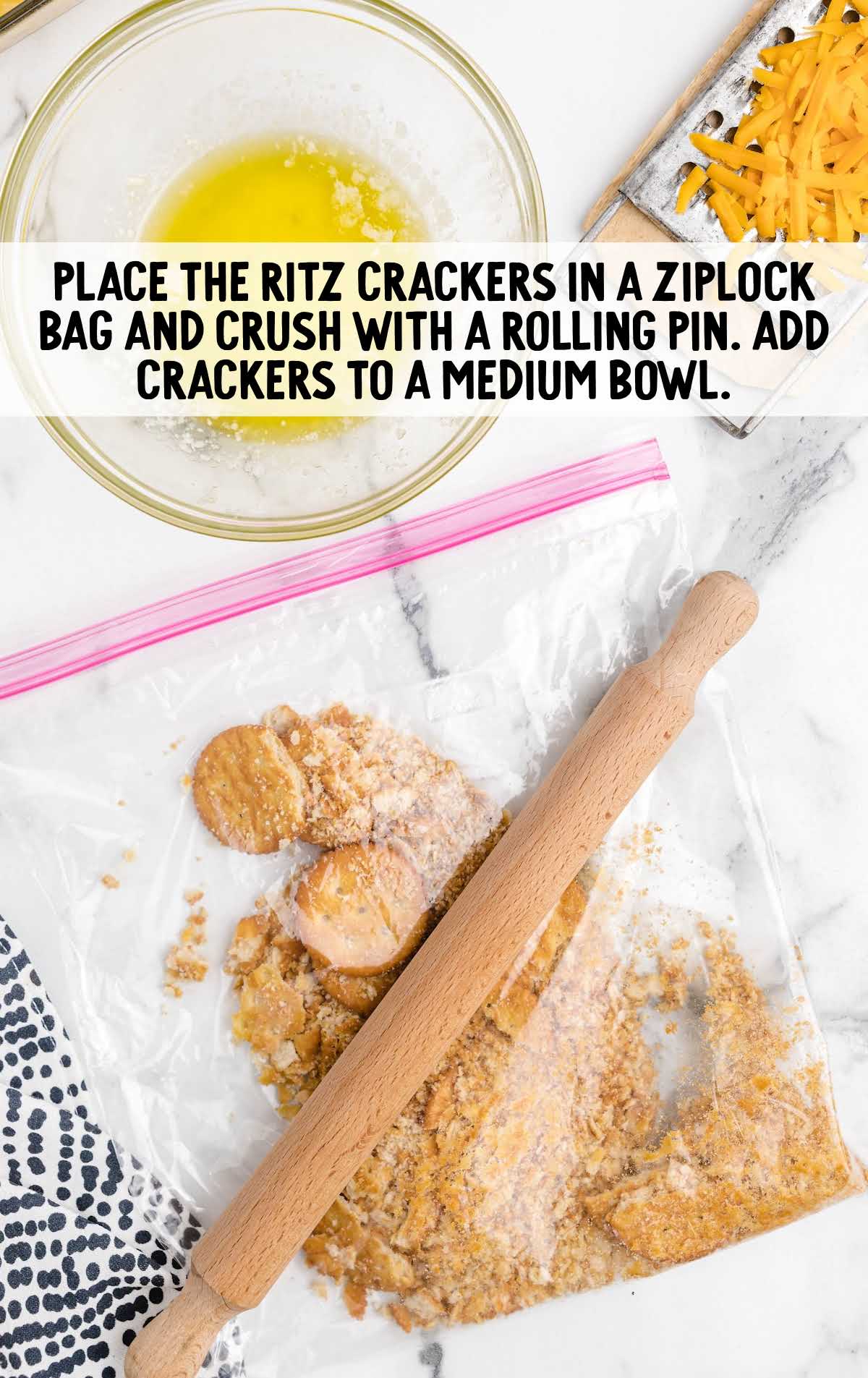 Chicken Casserole process shot of ritz crackers being crushed in a bag with a rolling pin
