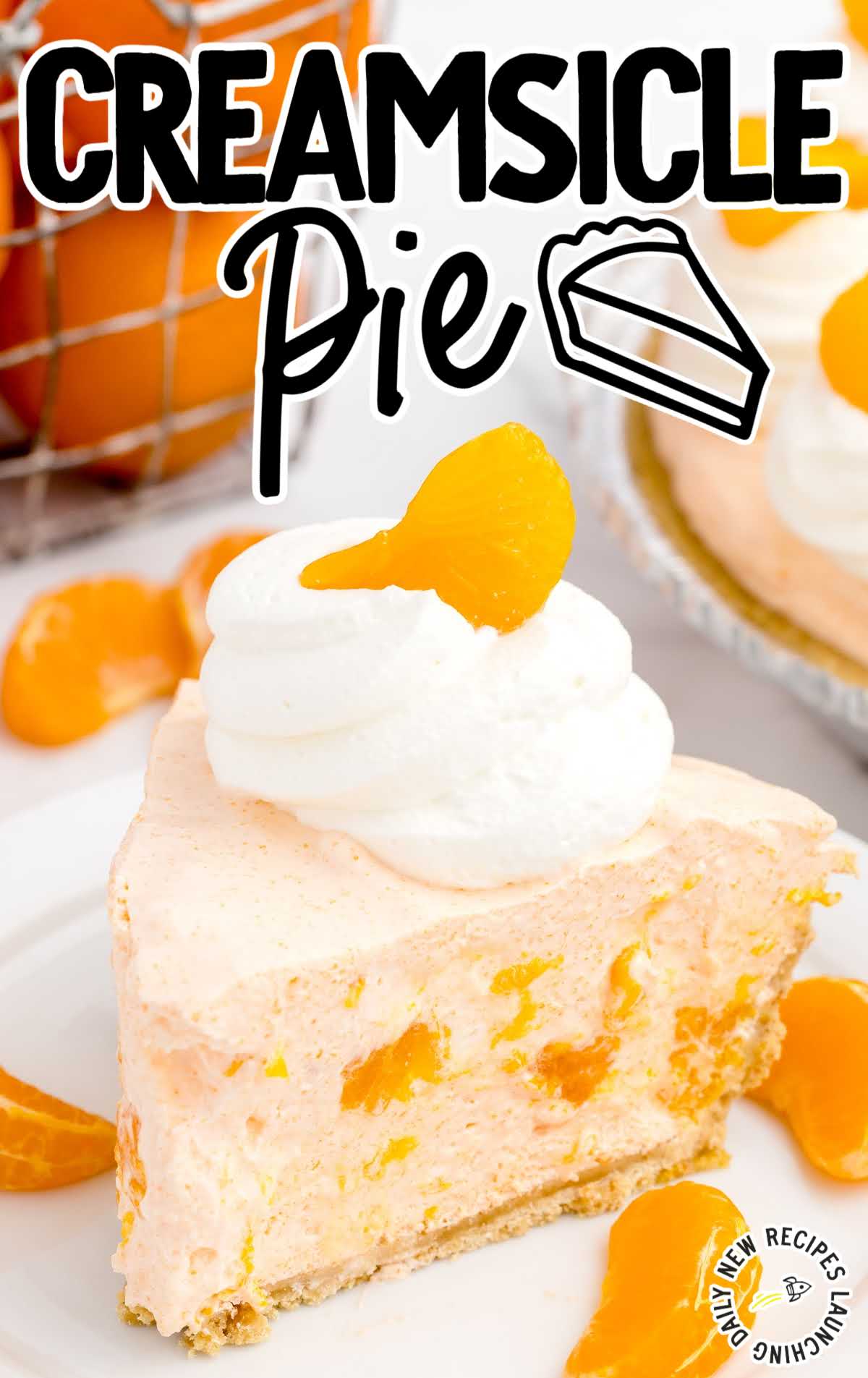 close up shot of a slice of pie topped with whipped cream and a mandarin orange on a plate