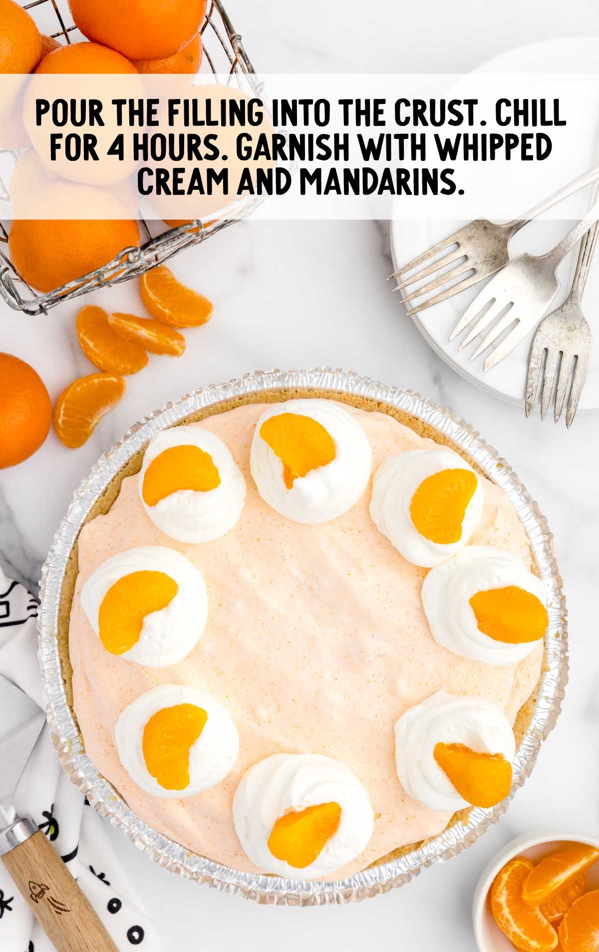 pie topped with whipped cream and mandarin oranges