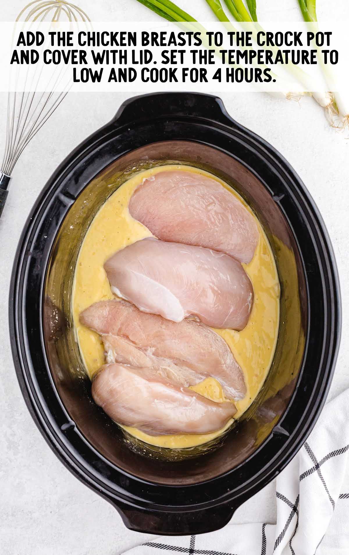 chicken breast added to the crockpot