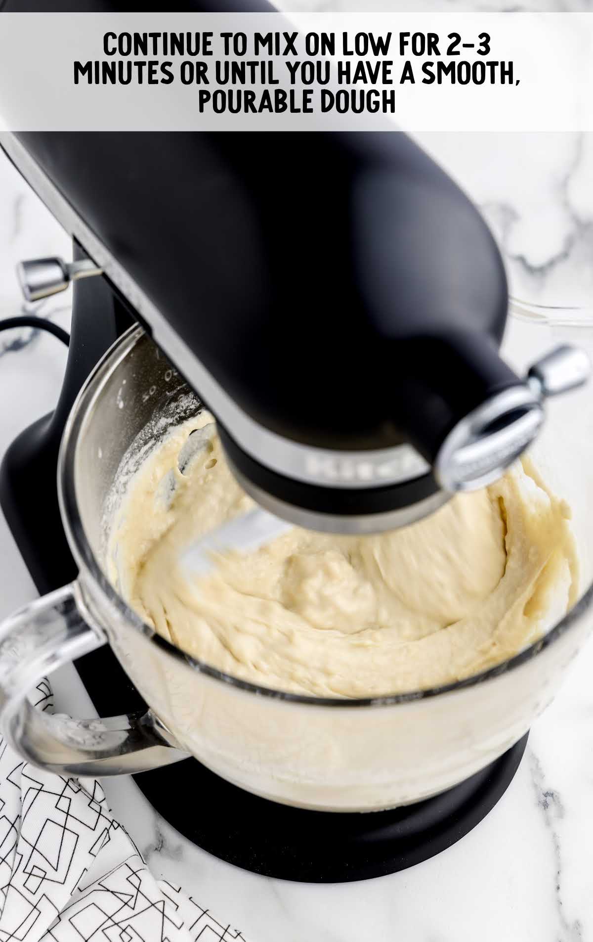 dough ingredients being blended in a blender