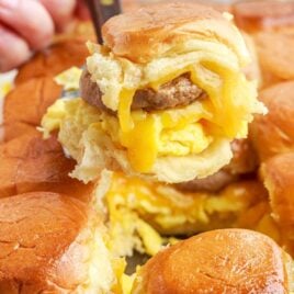 close up shot of a Sausage Egg and Cheese Slider being picked up with a spatula