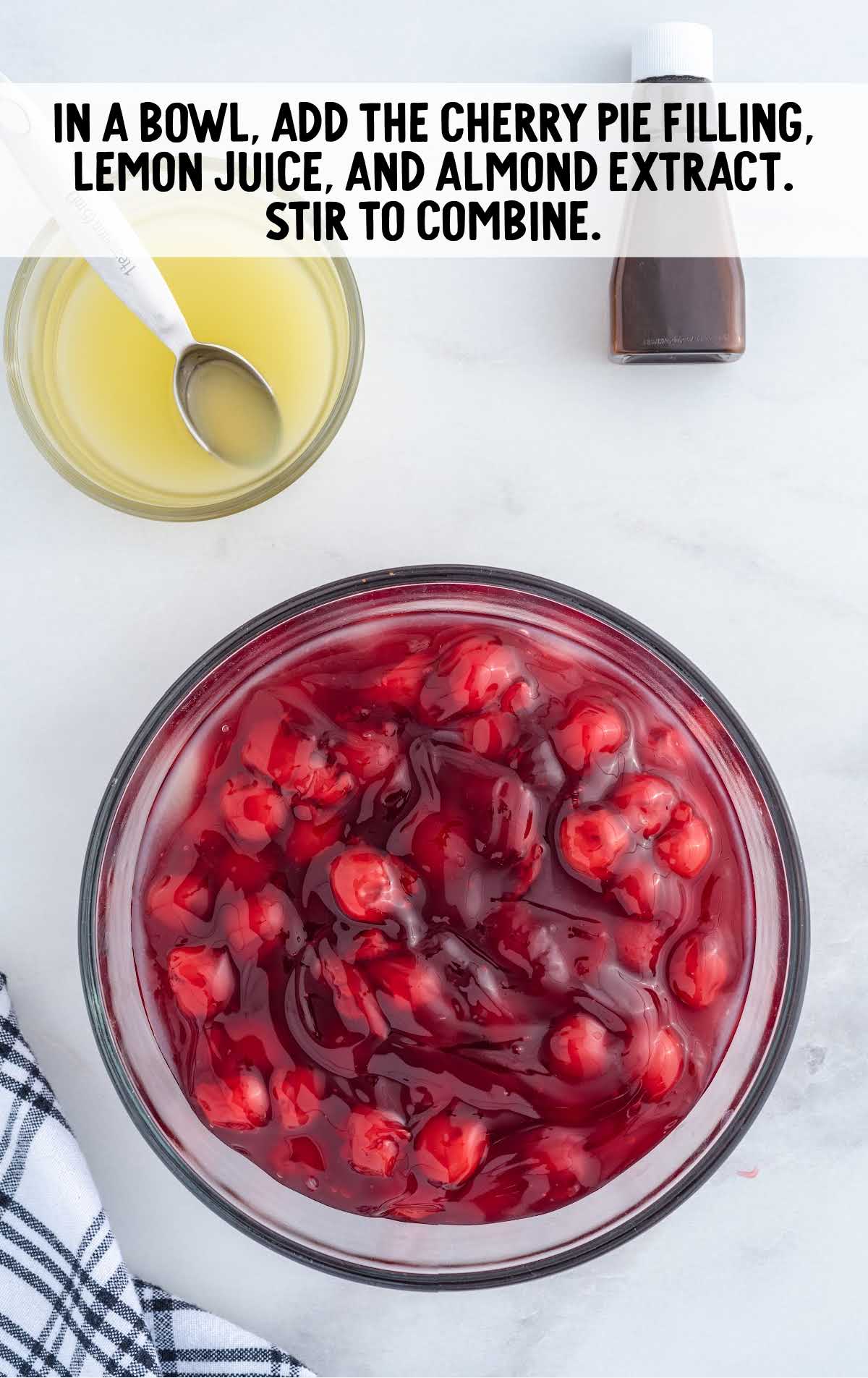 cherry pie filling, lemon juice, and almond extract combined in a bowl