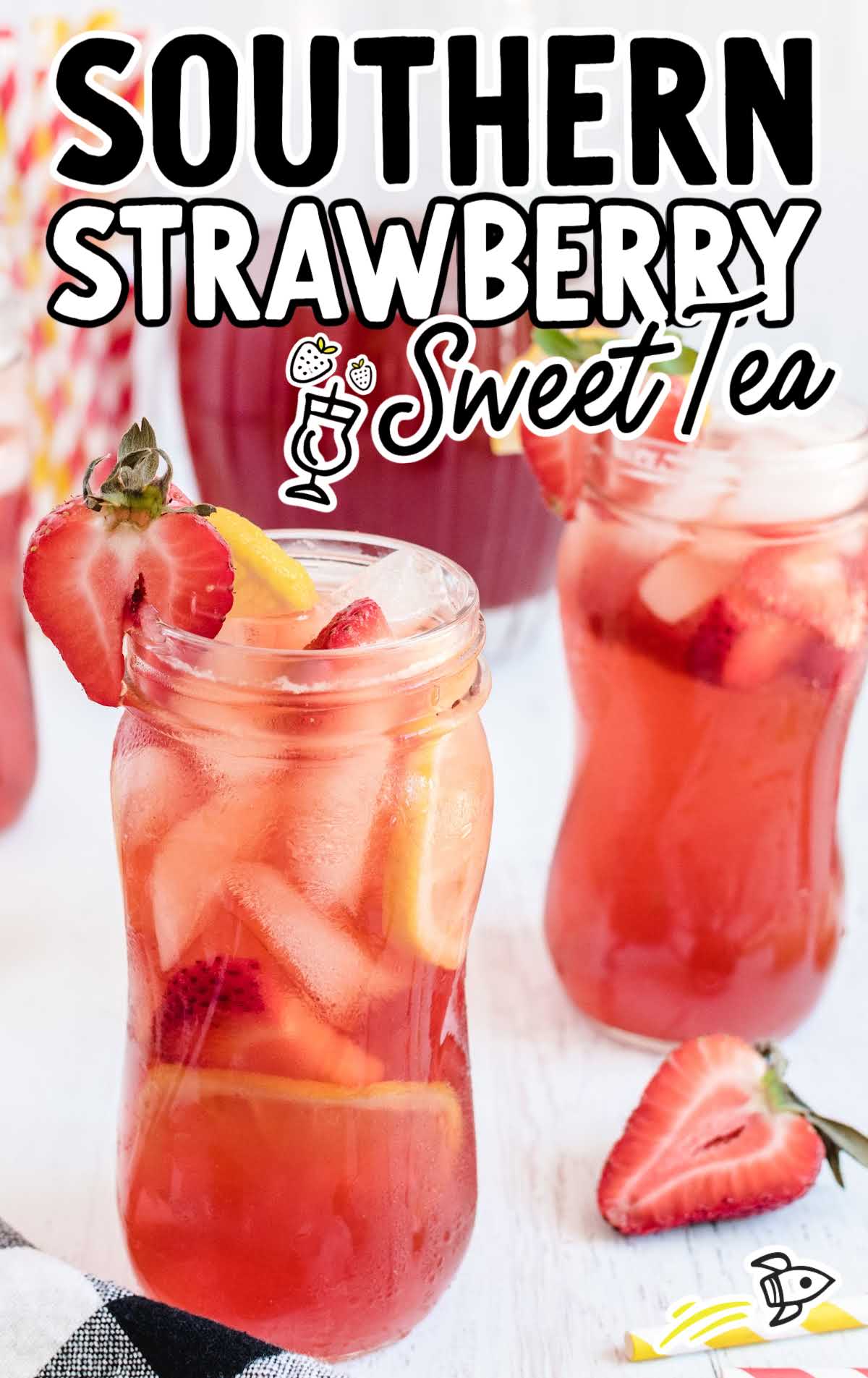 close up shot of glasses of Southern Strawberry Sweet Tea garnished with strawberry an lemon slices