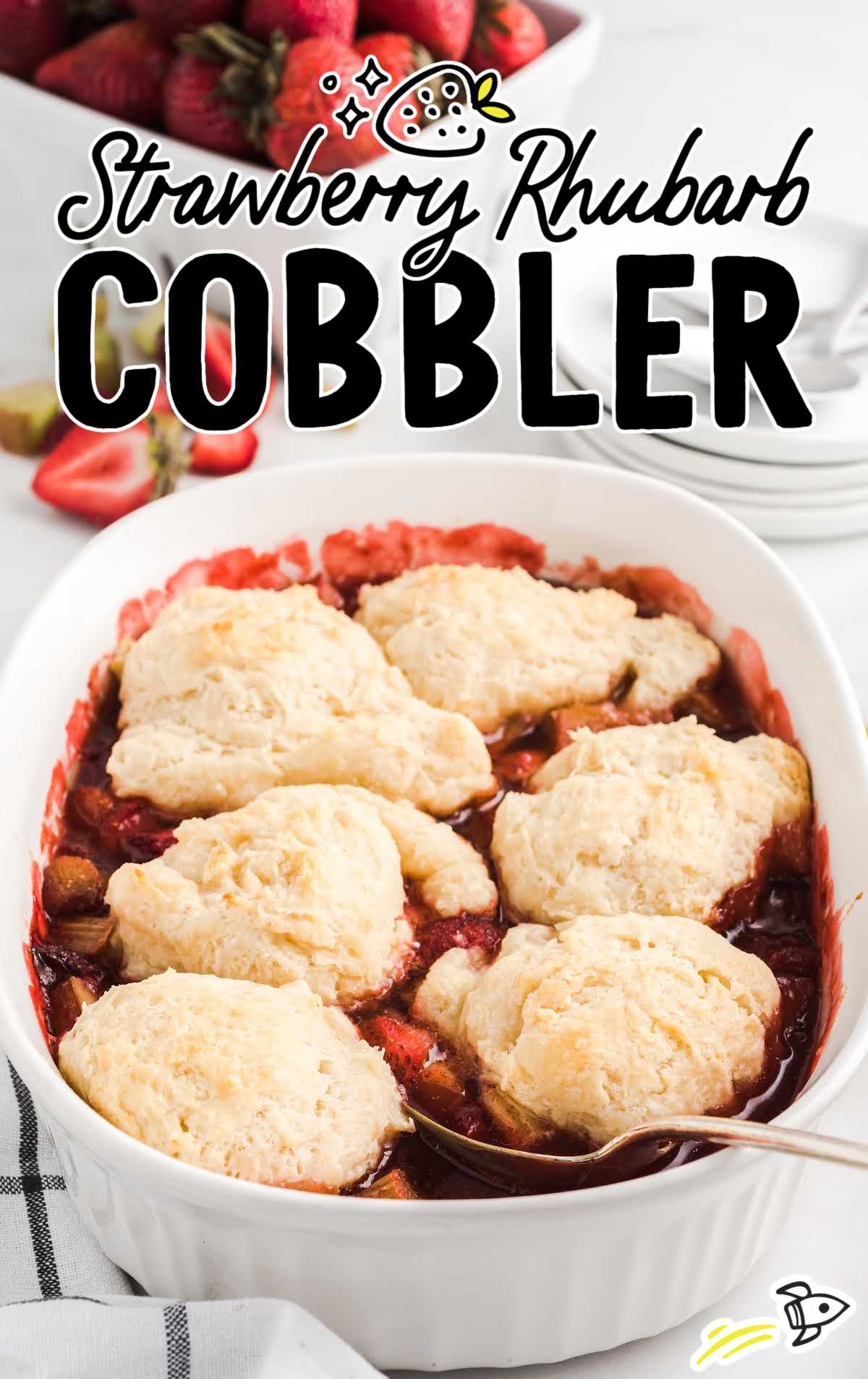 close up shot of a Strawberry Rhubarb Cobbler cobbler in a baking dish
