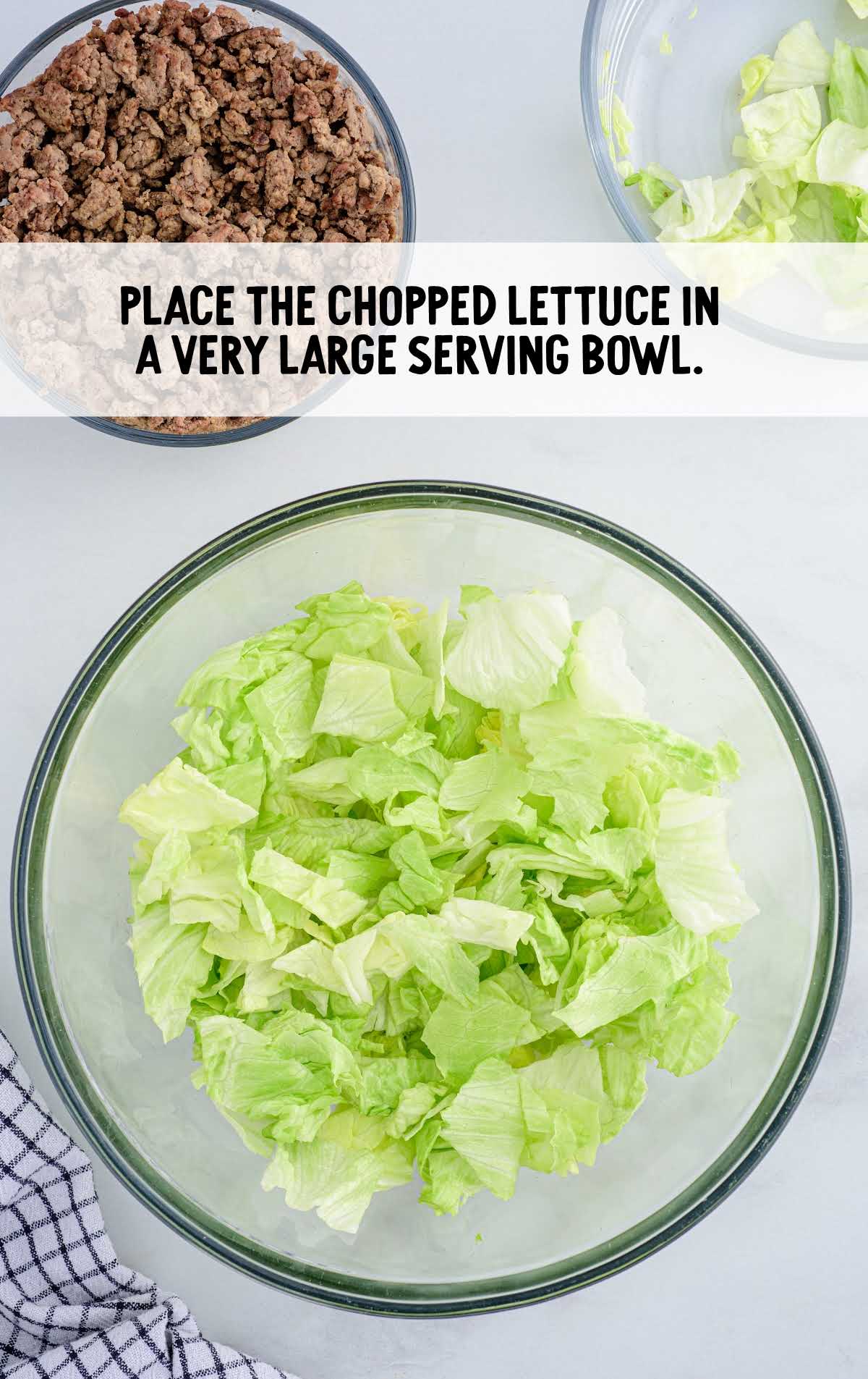 big Mac salad process shot of chopped lettuce placed in a large serving bowl