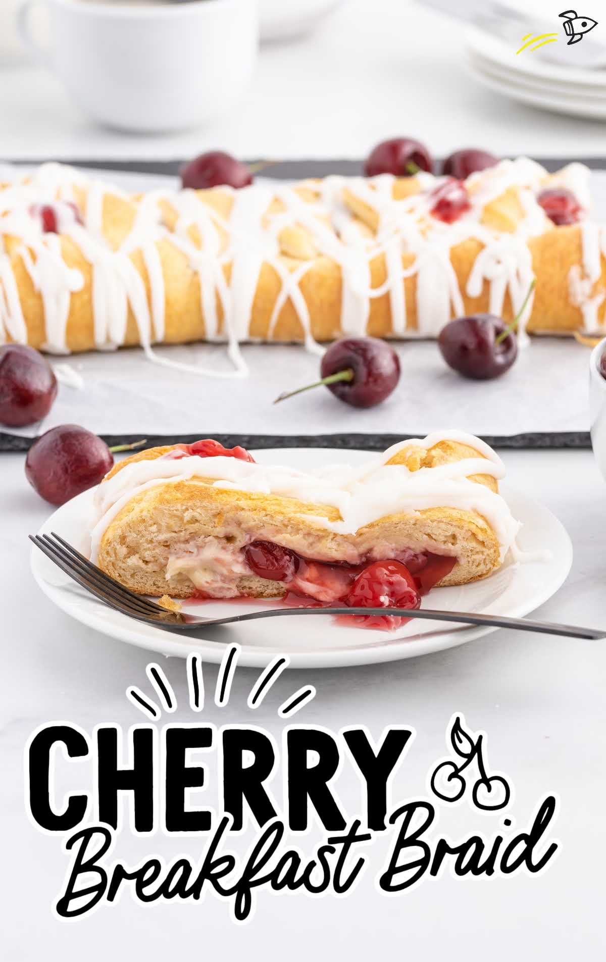 close up shot of a slice of cherry breakfast braid on a plate