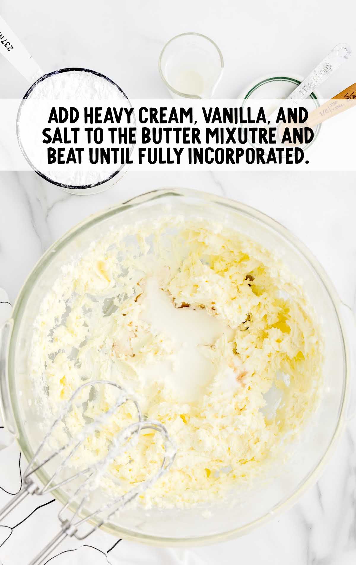 heavy cream, vanilla extract, and salt blended together to the butter and cream cheese in a bowl