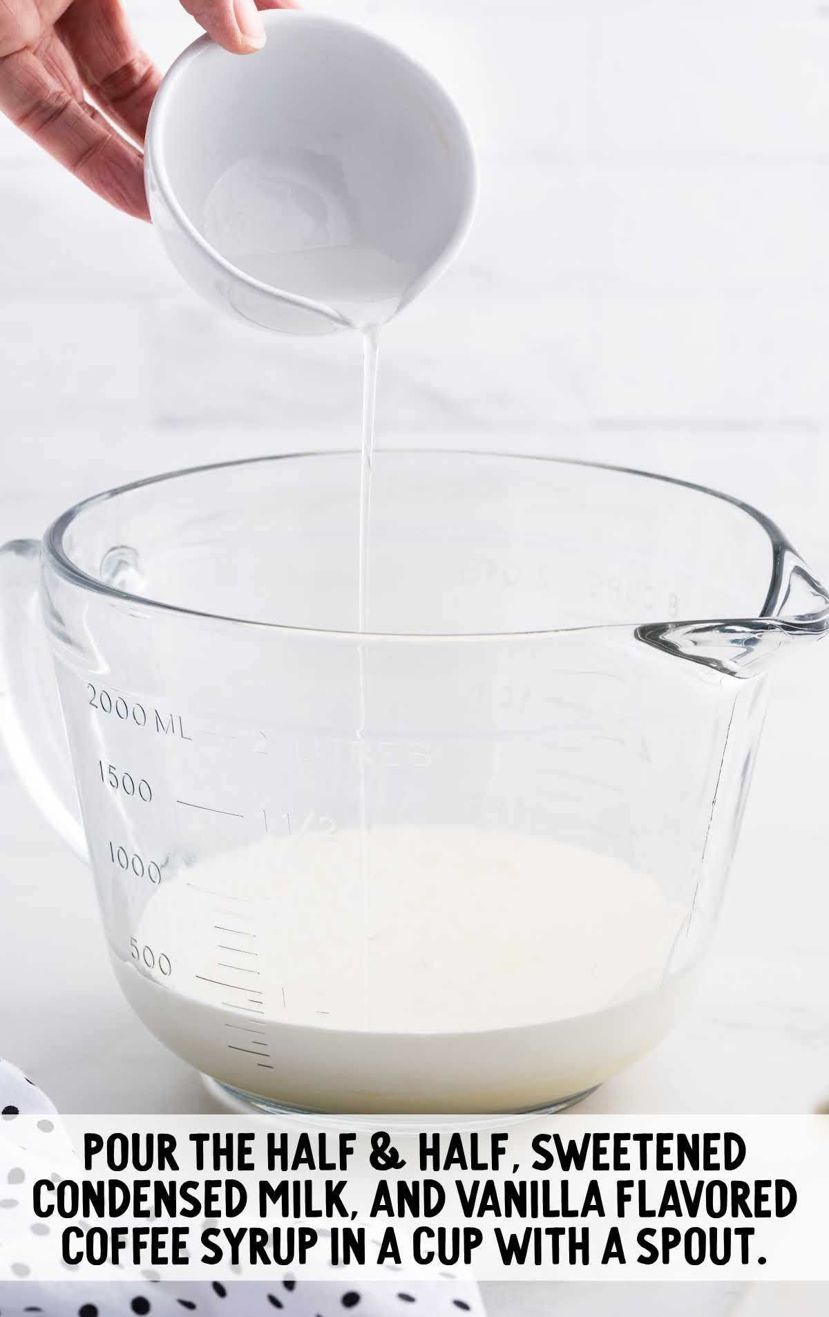 half & half, sweetened condense milk, and vanilla coffee syrup in a measuring cup