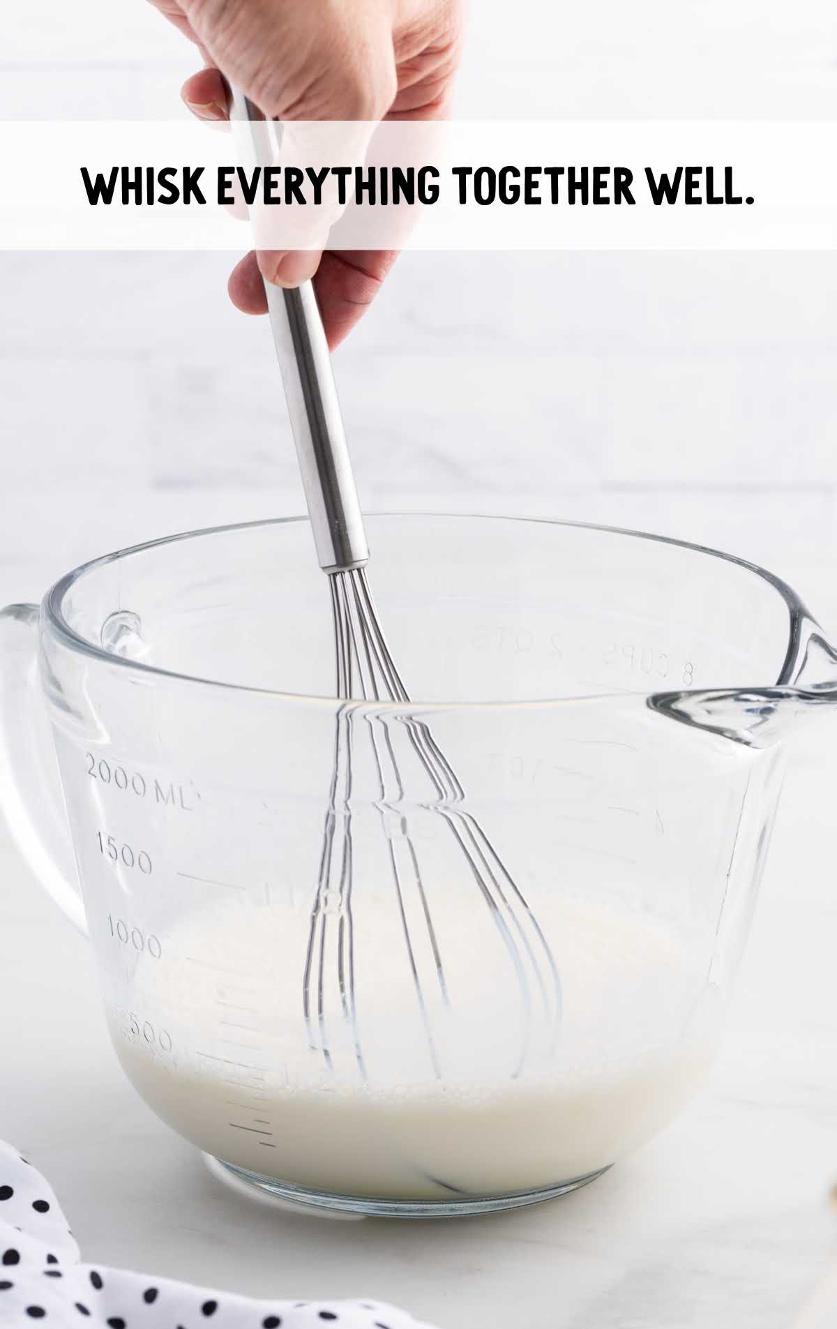 ingredients whisked in a measuring cup