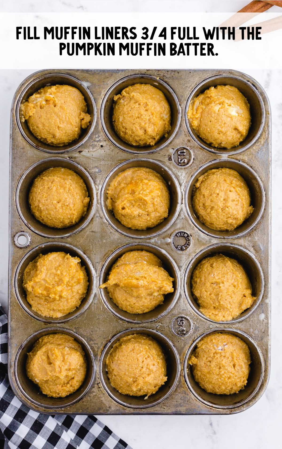 batter filled into a muffin pan