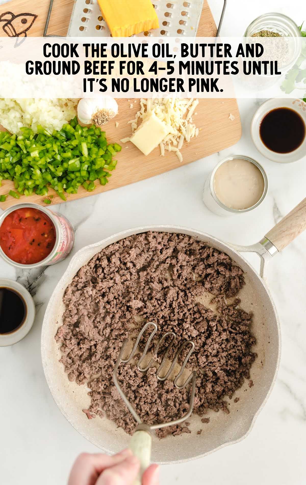 ground beef cooked into a skillet