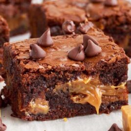 close up shot of Caramel Brownies topped with chocolate chips
