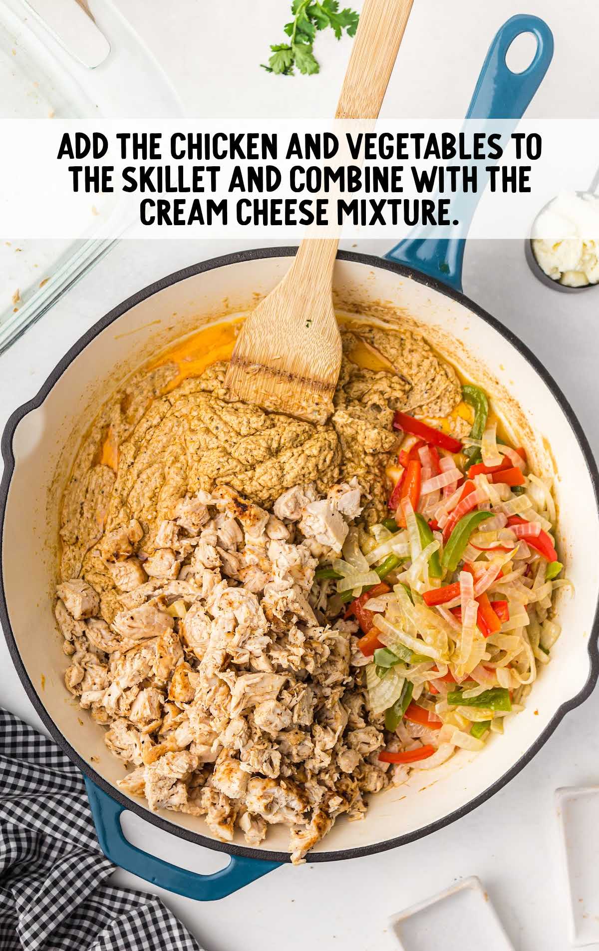 chicken and vegetables added to the cream cheese mixture in the skillet
